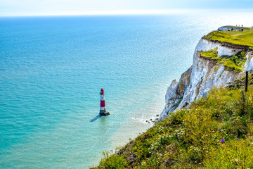 Beautiful coast landscape with lighthouse, white cliffs and blue sea