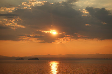 Beautiful sunset with clouds over the Aegean sea