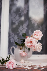 Beautiful flowers from   garden on   windowsill.