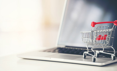 shopping cart with laptop on the desk