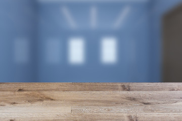 Empty interior with large window. Retro light bulb. The floor is of brown parquet.  3D rendering. wooden table. blurred background