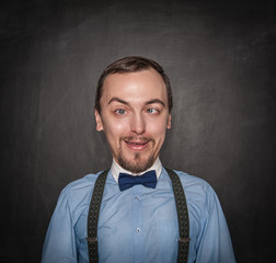 Funny crazy teacher or business man on blackboard