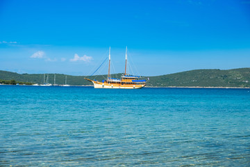 Fototapeta na wymiar Beautiful old style traditional boat anchored on Adriatic sea in Croatia, Dugi otok archipelago