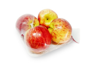 Apples in plastic package on white background. With clipping path.- Image