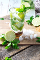 Mohito lime drinks on wooden with blur beach background