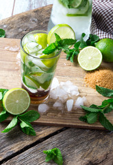 Mohito lime drinks on wooden with blur beach background