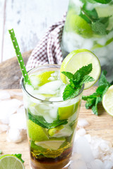 Mohito lime drinks on wooden with blur beach background