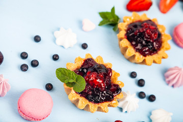 Small berry cake and ripe berries