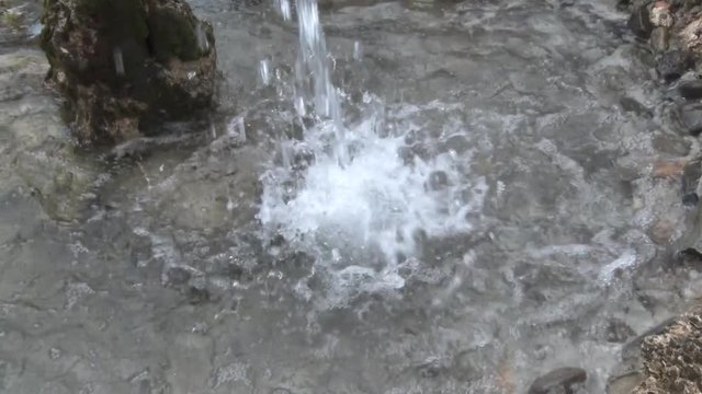 Water from the fountain falls into the water