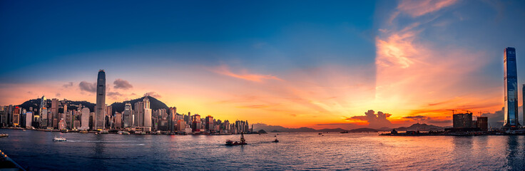 People enjoy the beautiful sunset in front of Victoria Harbor, Hong Kong 