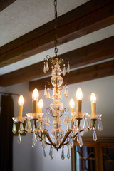 Old crystal chandelier with beautiful light.
