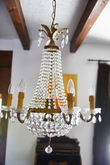 Old crystal chandelier with beautiful light.