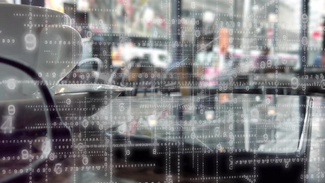 Coffee shop data array.  Grid or matrix of electronic numbers overlaid on a close up of a phone on a coffee shop table.