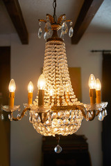 Old crystal chandelier with beautiful light.