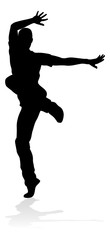Fototapeta na wymiar A male street dance hip hop dancer in silhouette