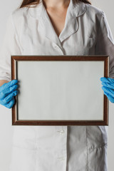 World health day. Doctors day. Prophylactic medical examination. Physician with whiteboard for copyspace on isolated white background. Medicine concepts.
