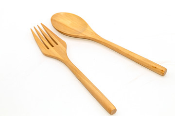 Handmade wooden spoon and fork isolated on white background.