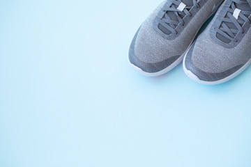 Men's sneakers on a colored background top view. men's footwear. minimalism