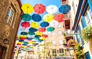 Fototapeta na wymiar Lot of Umbrellas in Petit Champlain street Quebec city