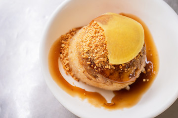 Rice pudding (Tube rice cake), popular delicious taiwanese street food gourmet delicacy, made by glutinous rice and pork with sweet chili sauce.