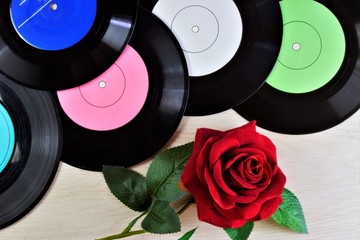 Vinyl round records, rose flower Queen - retro background music for club discos. Gramophone record,...