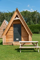 Cheltenham, Gloucetsershire, England, UK. July 2019. Wooden camping pods in the Cotswolds region of Gloucestershire