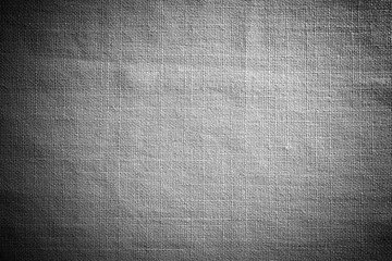 Texture canvas for background. Natural fiber fabric. Vignette around the edge of the frame.