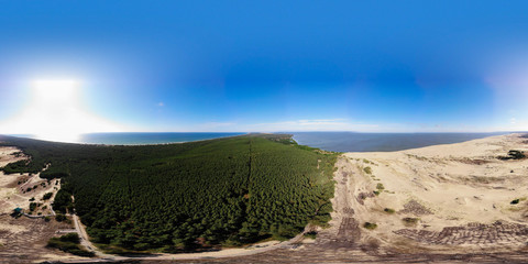 Curonian Spit and the Baltic Sea. View from the copter. Coastline with the beach and the sea. Nature conservation. View from the sky. The photo was taken by drone quadcopter.