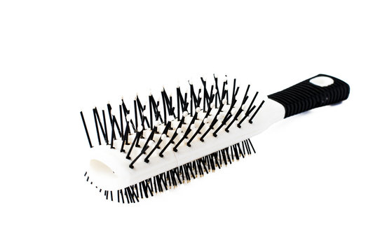 recommend clip art: White comb with black handle isolated on white background, copy space