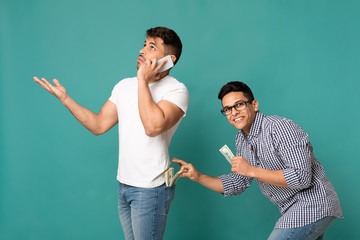 Thief Stealing Money From Man's Back Pocket On Turquoise Background