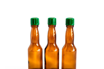 Clear front shoot of brown liquour bottles with white background