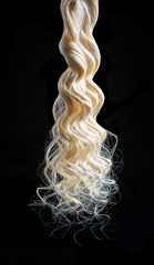 Hair natural white, bleached, curl.