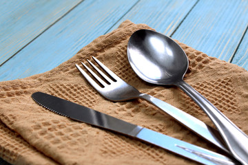Cutlery spoon, fork, knife lie on the table