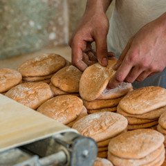 close up finished pink dough in the bakery on wooden table. Working process. Private bakery. Production of bread.