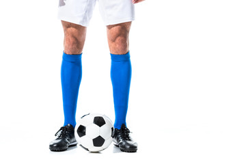 Cropped view of soccer player standing near ball Isolated On White