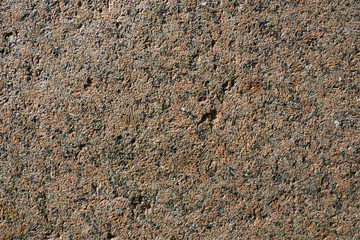 Abstract background from crushed granite. Stone, crushed into small parts for construction work. Summer. Day