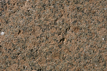 Background of old red brick. The wall of the old house without plaster. Brick is a durable material, but it collapses without a protective layer of plaster. Then the whole wall collapses.