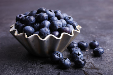 Ripe fresh blueberries in metal baking tin