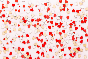 Happy Valentines day background. With small color hearts on gray background.