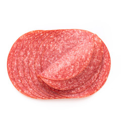 Salami slices on white background.