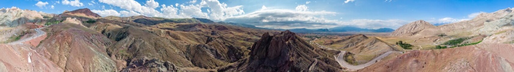 Aerial view of dirt roads on the plateau around Mount Ararat, dirt roads and breathtaking landscapes, winding roads between rocky peaks and hills. Heights around the palace of Ishak Pasha. Turkey