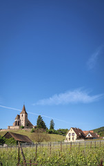 Magnificent Hunawihr village in Alsace, France, its grandiose vineyards and Saint-Jacques-le-Majeur church (route des vins d'Alsace)