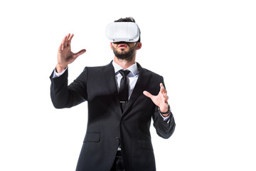 businessman in formal wear and virtual reality headset gesturing Isolated On White