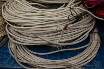 The market for electrical materials. Sale of electric cables. Multi-colored wire insulation. Copper core. Flexible cable. Summer. Day.