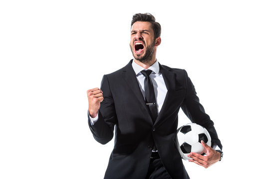 yelling businessman in formal wear with soccer ball and clenched hand Isolated On White