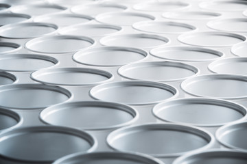 Obraz premium Background texture of white plastic cups standing in a row. Zero waste concept, plastic free