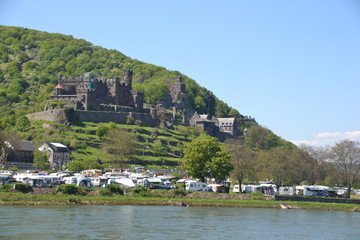 Fototapeta na wymiar Castles and Caravans - Reichenstein Castle as seen from the Rhine River