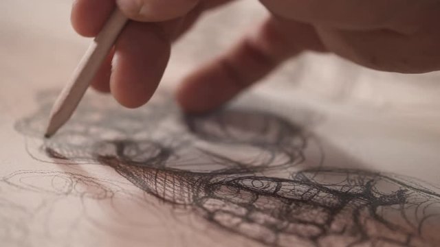 Male artists hand holding pencil and drawing the sketch of human hand. Sketching part of human body. Isolated, close-up demonstration video