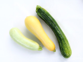 Set of vegetable marrows of different color on a white background