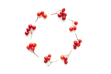Obraz premium Circle Made Of Red Berries On White Background